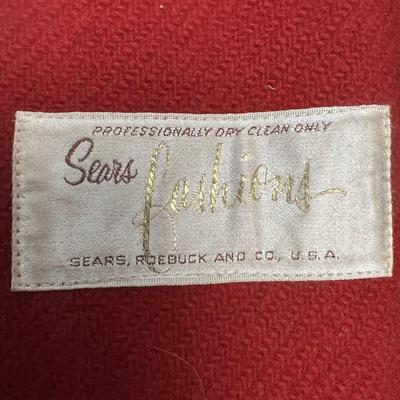 Sale Photo Thumbnail #280: This is a stunning coat.  Ladies wool coat with faux black fur trim, size small (Probably 4 to 6) 
It is in very good condition.