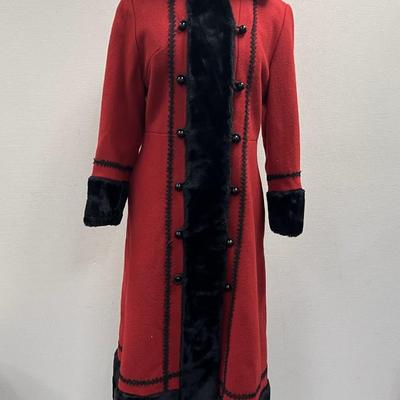 Sale Photo Thumbnail #279: This is a stunning coat.  Ladies wool coat with faux black fur trim, size small (Probably 4 to 6) 
It is in very good condition.