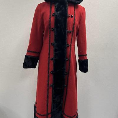 Sale Photo Thumbnail #278: This is a stunning coat.  Ladies wool coat with faux black fur trim, size small (Probably 4 to 6) 
It is in very good condition.