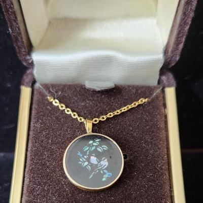 Sale Photo Thumbnail #291: Inlaid opal set in black onyx in a round pendant