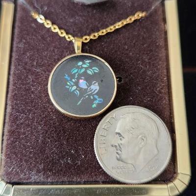 Sale Photo Thumbnail #290: Inlaid opal set in black onyx in a round pendant