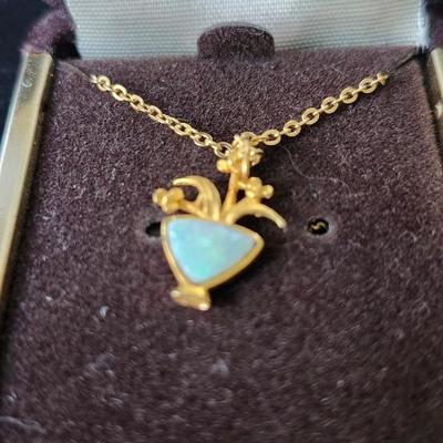Sale Photo Thumbnail #292: Gold filled necklace with opal inset in the vase shape /  flowers.