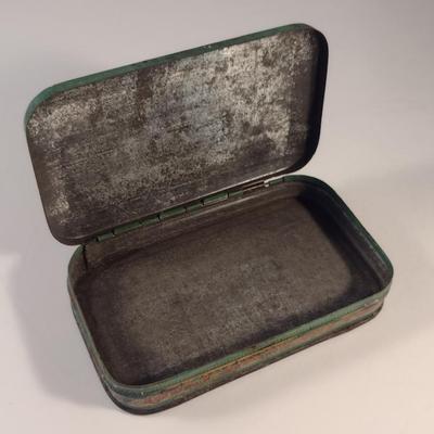 Sale Photo Thumbnail #174: Antique Lucky Strike Tobacco Tin- Circa 1920's- Approx 4 1/4" x 2 3/4" x 1 1/4" Tall.  Please see all pictures for condition.