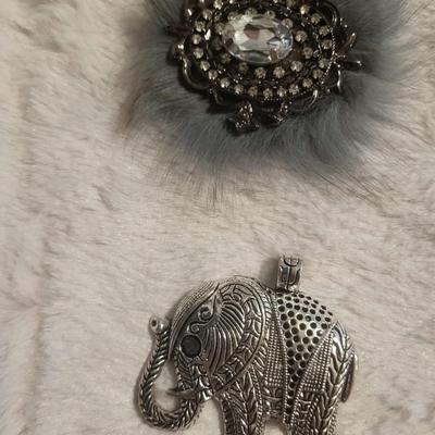 2 Silver-tone bracelets 3 Pendants 1 Brooch/clip 1 Pair post earrings