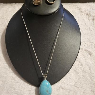 Turquoise stone with sterling necklace and elements. 2 Sterling rings 14 g size 5