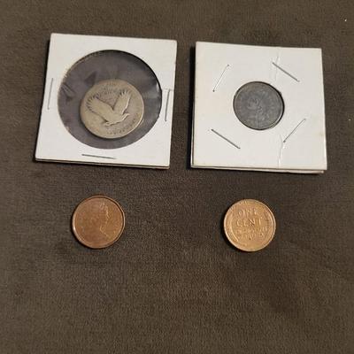 Silver standing quarter can’t read date 1906 Indian head nickel 1956 D wheat penny 1986 Canadian penny