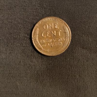 Silver standing quarter can’t read date 1906 Indian head nickel 1956 D wheat penny 1986 Canadian penny