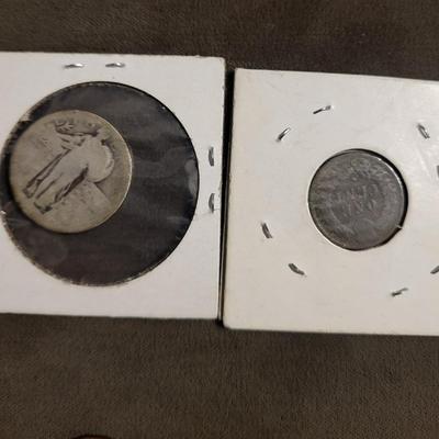 Silver standing quarter can’t read date 1906 Indian head nickel 1956 D wheat penny 1986 Canadian penny