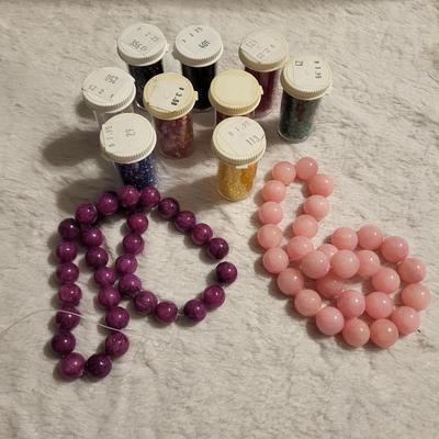 Nine bottles of beads natural rose beads, natural ruby beads