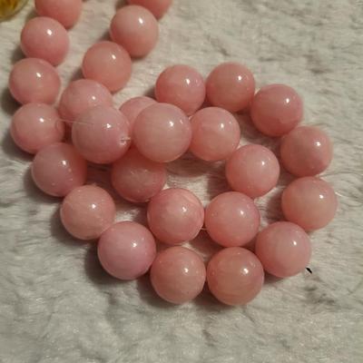 Nine bottles of beads natural rose beads, natural ruby beads