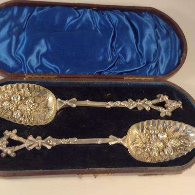 Sale Photo Thumbnail #220: Pair of Antique Repousse' Spoons with Storage Case- Circa 1870.  Items were curated from Scotland for Cannell & Chaffin.