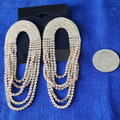 Sale Photo Thumbnail #301: Pierced, gold tone with strands that dangle