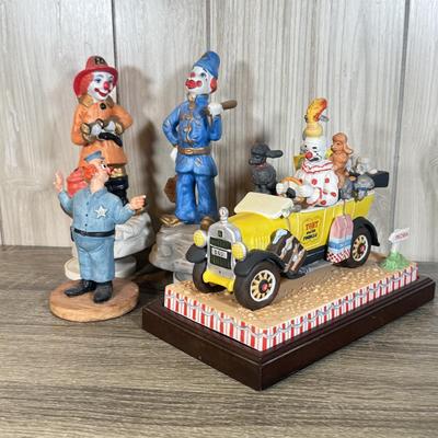 LOT 123B: Ron Lee Clown Car Sculpture w/ 2 Musical Clown Figures: Police & Fire