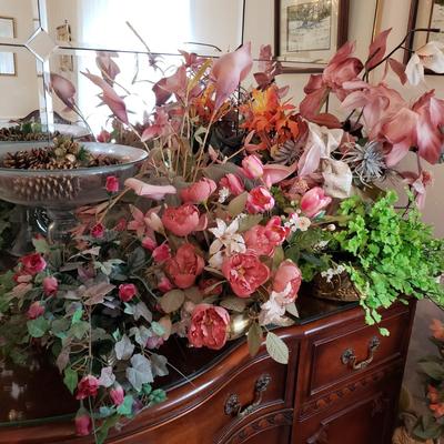 LOT 137D: Large Assortment of Faux Flower Arrangements in Brass Planters, Ceramic Vases & Large Glass Holiday Display Piece