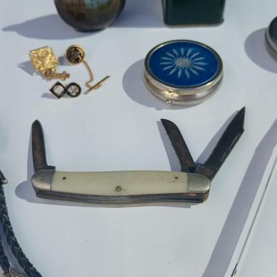 Neat variety of Curio keepsakes - ceramic table lighter - Pill box - vintage tape measure - pocketknife - Burrough's Adding Machine...