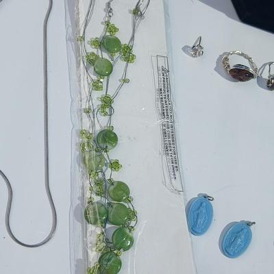 Variety of necklaces, rings, and three Virgin Mary Blue Miraculous pendants
