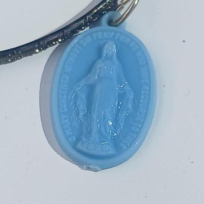 Variety of necklaces, rings, and three Virgin Mary Blue Miraculous pendants