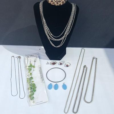 Variety of necklaces, rings, and three Virgin Mary Blue Miraculous pendants