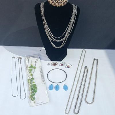 Variety of necklaces, rings, and three Virgin Mary Blue Miraculous pendants