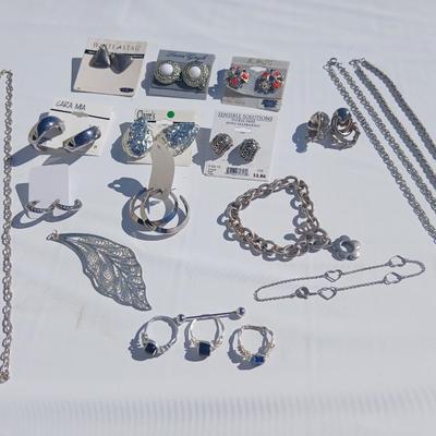 Silver toned earrings, necklaces, pendants and more - all silver in color