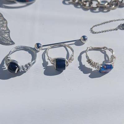 Silver toned earrings, necklaces, pendants and more - all silver in color