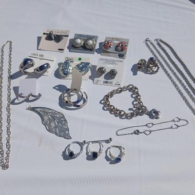 Silver toned earrings, necklaces, pendants and more - all silver in color