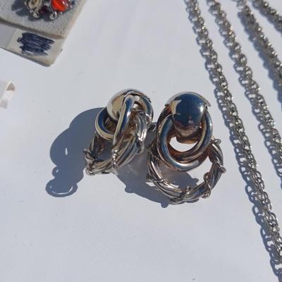Silver toned earrings, necklaces, pendants and more - all silver in color