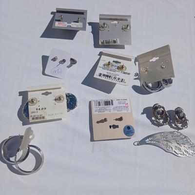 Silver toned earrings, necklaces, pendants and more - all silver in color