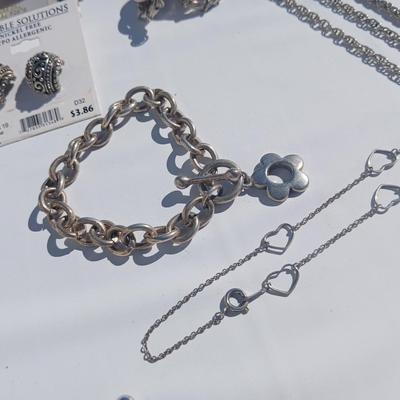 Silver toned earrings, necklaces, pendants and more - all silver in color