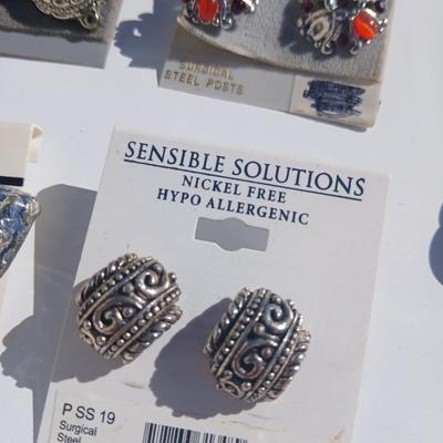 Silver toned earrings, necklaces, pendants and more - all silver in color