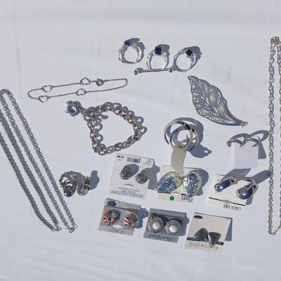 Silver toned earrings, necklaces, pendants and more - all silver in color