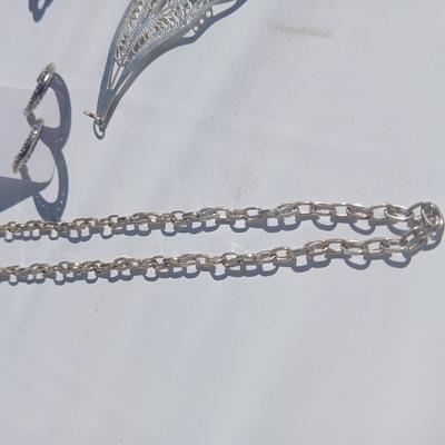 Silver toned earrings, necklaces, pendants and more - all silver in color