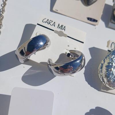 Silver toned earrings, necklaces, pendants and more - all silver in color