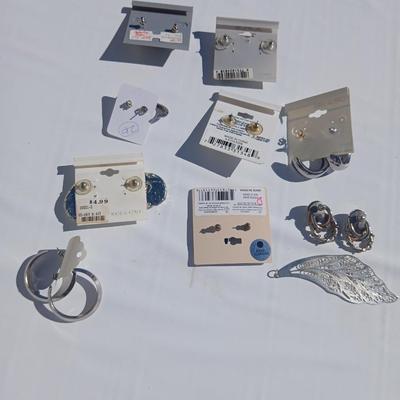 Silver toned earrings, necklaces, pendants and more - all silver in color