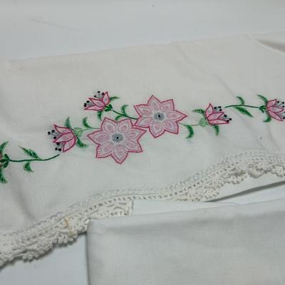 Vintage embroidered standard pillowcases - all have a pair except one