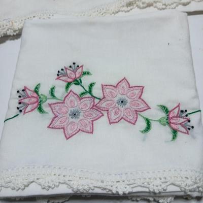 Vintage embroidered standard pillowcases - all have a pair except one