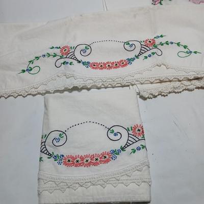 Vintage embroidered standard pillowcases - all have a pair except one