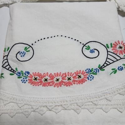 Vintage embroidered standard pillowcases - all have a pair except one