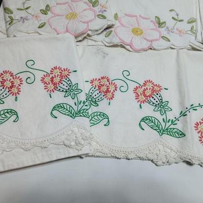 Vintage embroidered standard pillowcases - all have a pair except one