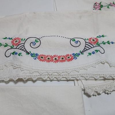 Vintage embroidered standard pillowcases - all have a pair except one