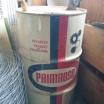 Steel Primrose oil company chemical barrel with vintage cast iron Syracuse Syraco valve spigot / Faucet