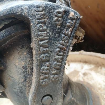 Steel Primrose oil company chemical barrel with vintage cast iron Syracuse Syraco valve spigot / Faucet