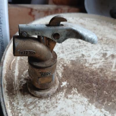Steel Primrose oil company chemical barrel with vintage cast iron Syracuse Syraco valve spigot / Faucet