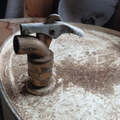 Steel Primrose oil company chemical barrel with vintage cast iron Syracuse Syraco valve spigot / Faucet