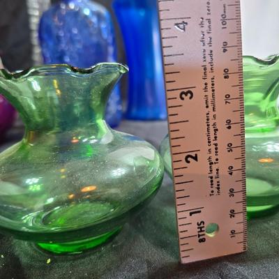 Variety of neat Colored glass vases, jar and bottles