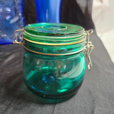 Variety of neat Colored glass vases, jar and bottles