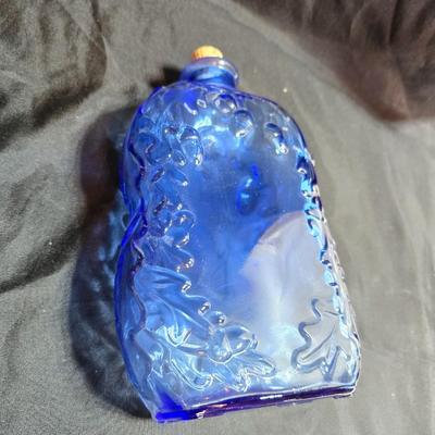 Variety of neat Colored glass vases, jar and bottles