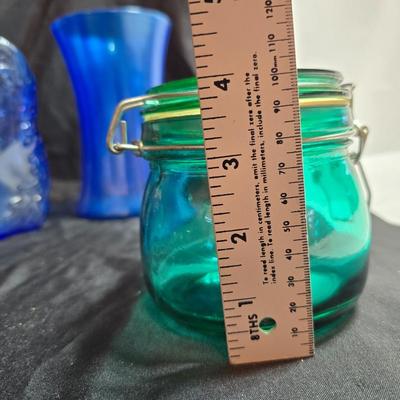 Variety of neat Colored glass vases, jar and bottles