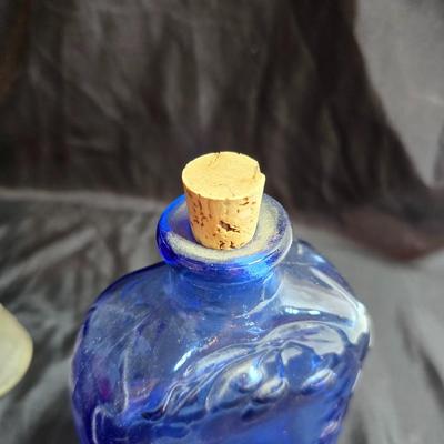 Variety of neat Colored glass vases, jar and bottles