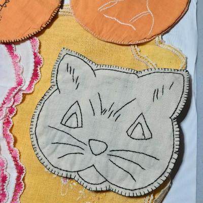 Assortment of embroidered cloth - flowers, cats and other cute patterns